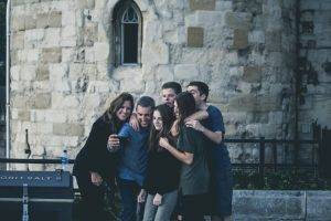 Family taking a picture in front of a castle