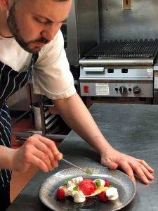 Chef David at work testing the food.